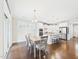Dining room connected to the kitchen showcasing an open layout and stainless steel appliances at 524 Rowanwood Way, Apex, NC 27523