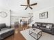 Open-concept living room shows the kitchen and dining areas, with hardwood floors and lots of light at 524 Rowanwood Way, Apex, NC 27523