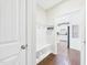 Functional mudroom with a storage bench, hooks, and access to the kitchen at 524 Rowanwood Way, Apex, NC 27523