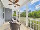Relaxing screened-in porch with ceiling fan and outdoor seating offering serene views of the landscaped backyard at 524 Rowanwood Way, Apex, NC 27523
