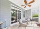Comfortable screened-in porch with ceiling fan, and outdoor seating, seamlessly blending indoor comfort with outdoor charm at 524 Rowanwood Way, Apex, NC 27523