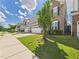 A street view of a neighborhood showcasing well-maintained lawns and varied two-story home exteriors at 524 Rowanwood Way, Apex, NC 27523