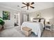Bedroom featuring a neutral color scheme, ceiling fan, and an attached bathroom at 5409 Knollwood Rd Rd, Raleigh, NC 27609
