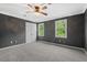 Bright bedroom with soft carpet, double closets, and two bright windows at 5409 Knollwood Rd Rd, Raleigh, NC 27609