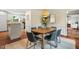 Comfortable dining area featuring modern furnishings, bright lighting, and a neutral color palette at 5409 Knollwood Rd Rd, Raleigh, NC 27609