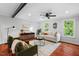 Bright living room with hardwood floors, neutral paint, modern decor, and plenty of natural light at 5409 Knollwood Rd Rd, Raleigh, NC 27609
