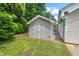 A backyard features a well-maintained shed for extra storage and green space at 5409 Knollwood Rd Rd, Raleigh, NC 27609