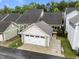 Aerial view of attached garage and home with charming back porch at 5644 Wade Park Blvd, Raleigh, NC 27607