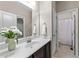 Well-lit bathroom features a clean white countertop, modern fixtures, and a view of the shower and toilet space at 5644 Wade Park Blvd, Raleigh, NC 27607