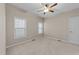 Neutral bedroom with natural light from windows and ceiling fan at 5644 Wade Park Blvd, Raleigh, NC 27607
