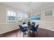 Bright dining area with hardwood floors, chandelier, and view of the exterior at 5644 Wade Park Blvd, Raleigh, NC 27607