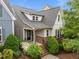 Charming two-story home with manicured landscaping, brick accents, and a welcoming front porch at 5644 Wade Park Blvd, Raleigh, NC 27607