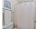 This full bathroom features a shower with a white curtain, neutral walls, and a toilet and towel rack at 5644 Wade Park Blvd, Raleigh, NC 27607