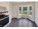 Eat-in kitchen features a bay window and stainless steel appliances at 5749 Stone Crystal Dr, Fuquay Varina, NC 27526