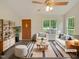 Bright living room with hardwood floors and comfortable seating arrangements with modern decorations at 5749 Stone Crystal Dr, Fuquay Varina, NC 27526