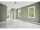 Bright, neutral bedroom with large windows providing backyard views at 60 Purslane Dr, Franklinton, NC 27525