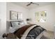 Comfortable bedroom with modern ceiling fan, neutral paint, stylish decor, and bright window at 60 Purslane Dr, Franklinton, NC 27525