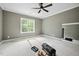 Spacious bedroom features a ceiling fan, large window, and ready for customization at 60 Purslane Dr, Franklinton, NC 27525