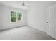 Bright, neutral bedroom with large window and a ceiling fan at 60 Purslane Dr, Franklinton, NC 27525