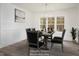 Elegant dining room with stylish decor and ample natural light, perfect for entertaining, virtually staged at 60 Purslane Dr, Franklinton, NC 27525