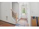 Bright entryway with a staircase and a front door view, showcasing the home's entrance at 60 Purslane Dr, Franklinton, NC 27525