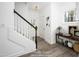 Welcoming foyer with staircase, stylish decor, and plenty of natural light, virtually staged at 60 Purslane Dr, Franklinton, NC 27525