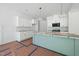 Open-concept kitchen with white cabinets, an island, and modern appliances at 60 Purslane Dr, Franklinton, NC 27525