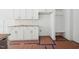 Bright kitchen featuring white cabinets, stainless appliances, subway tile backsplash and seating at 60 Purslane Dr, Franklinton, NC 27525
