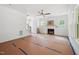 Spacious living room area with fireplace, staircase, and large windows for natural light at 60 Purslane Dr, Franklinton, NC 27525