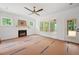 Living room featuring a fireplace, neutral walls, and natural light from multiple windows at 60 Purslane Dr, Franklinton, NC 27525
