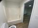 Full bathroom with a shower-tub combo at 609 N Magnolia Ave, Dunn, NC 28334