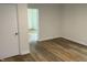 Bedroom with new flooring, neutral paint, and open doorway at 609 N Magnolia Ave, Dunn, NC 28334