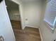 Cozy laundry area with convenient hook-ups and wood-look flooring at 609 N Magnolia Ave, Dunn, NC 28334