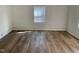 Living room with plank flooring, fresh paint and lots of natural light at 609 N Magnolia Ave, Dunn, NC 28334