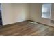 Bright living room featuring wood-style floors and lots of natural light at 609 N Magnolia Ave, Dunn, NC 28334