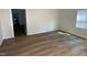 Living room with newly refinished floors and freshly painted walls at 609 N Magnolia Ave, Dunn, NC 28334