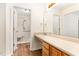 Bright bathroom with a walk-in shower, accessible features, and ample counter space at 6321 Lymington Dr, Raleigh, NC 27616