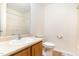 Bathroom features a toilet, sink with faucet, and a mirror above the sink at 6321 Lymington Dr, Raleigh, NC 27616