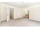 Spacious bedroom with carpet, a ceiling light, and access to the bathroom at 6321 Lymington Dr, Raleigh, NC 27616