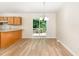 Dining area with hardwood floors, chandelier, and access to the deck at 6321 Lymington Dr, Raleigh, NC 27616