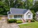 Charming single-Gathering home with a well-manicured lawn and classic architectural details at 6321 Lymington Dr, Raleigh, NC 27616