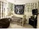 Cozy bedroom with unique tree-themed wall decor, paired with soft lighting and comfortable furnishings at 7 Shepherd Ln # Bldg D, Chapel Hill, NC 27514