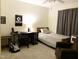 Well-lit bedroom featuring desk space and decorative wall art for a personal touch at 7 Shepherd Ln # Bldg D, Chapel Hill, NC 27514