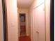 Hallway leading to a bathroom and featuring multiple storage closets at 7 Shepherd Ln # Bldg D, Chapel Hill, NC 27514