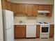 Functional kitchen with white appliances, plenty of cabinet space, and light countertops at 7 Shepherd Ln # Bldg D, Chapel Hill, NC 27514
