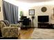 Inviting living space featuring neutral walls, comfortable seating, and a desk area at 7 Shepherd Ln # Bldg D, Chapel Hill, NC 27514