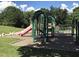 Fun playground equipment surrounded by green space and shady trees at 7 Shepherd Ln # Bldg D, Chapel Hill, NC 27514