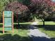 Well-maintained walking trail with signage and lush surroundings, perfect for outdoor activities and nature enthusiasts at 7 Shepherd Ln # Bldg D, Chapel Hill, NC 27514