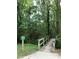 Scenic walking trail with a small bridge, surrounded by verdant trees and foliage, inviting nature enthusiasts at 7 Shepherd Ln # Bldg D, Chapel Hill, NC 27514