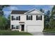 Charming two-story home with white siding, black shutters, and well-manicured front lawn at 7270 Michelle Rd, Rocky Mount, NC 27803